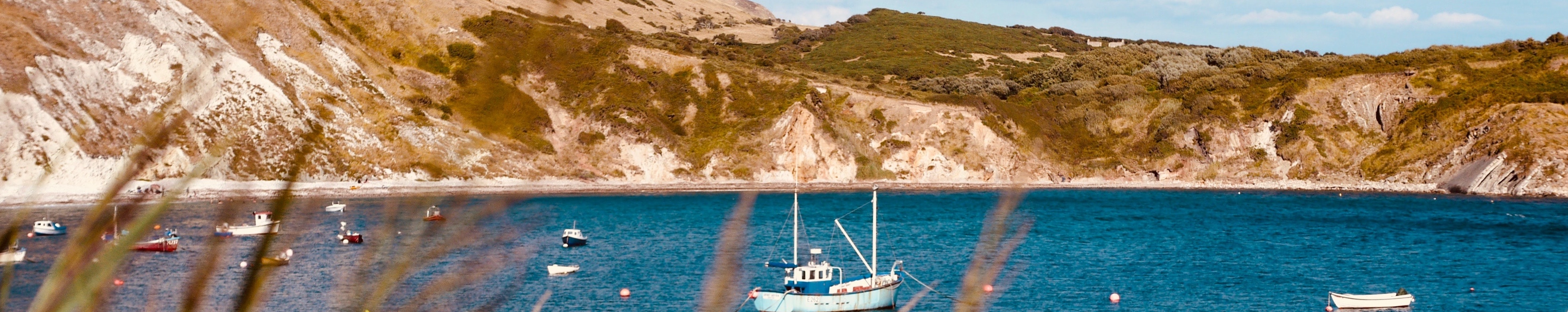 Stunning view from Lulworth Cove with Boats on the Sea